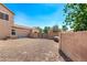 Spacious backyard features a secure gate and low-maintenance desert landscaping, ready for your personal touch at 21605 S 187Th Way, Queen Creek, AZ 85142