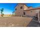 Expansive backyard showcases neutral stucco exterior, ample space, and potential for outdoor customization and entertainment at 21605 S 187Th Way, Queen Creek, AZ 85142