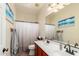 Bathroom features a dual sink vanity, large mirror, and updated fixtures at 21605 S 187Th Way, Queen Creek, AZ 85142