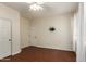 Clean and neutral bedroom features wood-look flooring and a ceiling fan at 21605 S 187Th Way, Queen Creek, AZ 85142