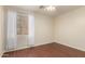 Neutral bedroom features wood-look flooring and a bright window at 21605 S 187Th Way, Queen Creek, AZ 85142
