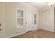 Bright entryway with tile flooring, shuttered windows, and a white front door at 21605 S 187Th Way, Queen Creek, AZ 85142