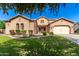 Charming two-story home features a manicured front yard and a spacious two-car garage at 21605 S 187Th Way, Queen Creek, AZ 85142