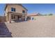 Expansive backyard with a covered patio area, perfect for outdoor entertainment at 22328 W Woodlands Ave, Buckeye, AZ 85326