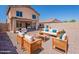 Spacious backyard with outdoor seating areas and a private, fenced yard at 22328 W Woodlands Ave, Buckeye, AZ 85326