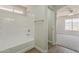 Bathroom showing the bathtub, a view to the bedroom, and a towel rack at 22328 W Woodlands Ave, Buckeye, AZ 85326