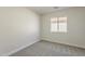 Cozy bedroom with carpet and a window for natural light, creating a relaxing atmosphere at 22328 W Woodlands Ave, Buckeye, AZ 85326