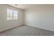 Bedroom with neutral carpet and natural light from a window at 22328 W Woodlands Ave, Buckeye, AZ 85326