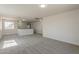 Bonus room with carpet and abundant light; perfect for entertaining or relaxing at 22328 W Woodlands Ave, Buckeye, AZ 85326