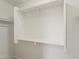 Walk-in closet featuring white shelving and a hanging rod at 22328 W Woodlands Ave, Buckeye, AZ 85326