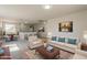 Living room features comfortable seating, stylish decor, and an adjacent dining area at 22328 W Woodlands Ave, Buckeye, AZ 85326