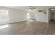 Bright, open space featuring light wood floors, large windows, and a staircase at 22328 W Woodlands Ave, Buckeye, AZ 85326