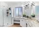 Bright bathroom featuring granite countertops and a glass-enclosed shower at 2425 W Shady Glen Ave, Phoenix, AZ 85023