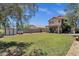 Well-maintained backyard with a patio, perfect for entertaining, and a green lawn extending to a privacy fence at 25409 N 40Th Ln, Phoenix, AZ 85083