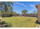 Expansive backyard with lush lawn, storage shed, and privacy fence, perfect for outdoor activities at 25409 N 40Th Ln, Phoenix, AZ 85083