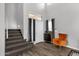 Light and airy entryway with high ceilings, gray walls, carpeted stairs, and luxury vinyl plank flooring at 25409 N 40Th Ln, Phoenix, AZ 85083