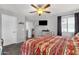 Spacious main bedroom with a comfortable bed, ceiling fan, and neutral color palette at 25409 N 40Th Ln, Phoenix, AZ 85083