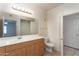 Bathroom featuring a vanity with a large mirror and ample lighting at 295 N Rural Rd # 143, Chandler, AZ 85226