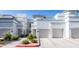 Inviting exterior view of a two-story home with a well-maintained lawn and attached garage at 295 N Rural Rd # 143, Chandler, AZ 85226