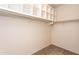 Spacious walk-in closet with built-in shelving and hanging rods for ample storage at 295 N Rural Rd # 143, Chandler, AZ 85226