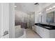 Luxurious bathroom featuring a soaking tub, walk-in shower, and double vanity sinks at 310 S 4Th St # 601, Phoenix, AZ 85004