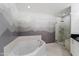 Bright bathroom with a soaking tub, a walk-in shower and stylish mountain scene paint at 310 S 4Th St # 601, Phoenix, AZ 85004
