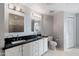 Bright bathroom featuring double sinks, white cabinetry, and modern fixtures at 310 S 4Th St # 601, Phoenix, AZ 85004