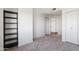 Neutral bedroom with carpet floors and a built-in shelving unit at 310 S 4Th St # 601, Phoenix, AZ 85004