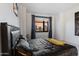 Modern bedroom with skyline view framed by window at 310 S 4Th St # 601, Phoenix, AZ 85004