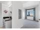 Modern bedroom with an ensuite vanity and a large window overlooking the city at 310 S 4Th St # 601, Phoenix, AZ 85004