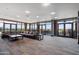 Spacious community area with a large sectional sofa, floor to ceiling windows, and an outdoor terrace at 310 S 4Th St # 601, Phoenix, AZ 85004