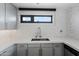 Close-up of kitchen sink with modern backsplash and hardware at 310 S 4Th St # 601, Phoenix, AZ 85004