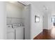 Washer and dryer in a dedicated laundry space with overhead lighting and storage at 310 S 4Th St # 601, Phoenix, AZ 85004