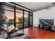 Modern living room boasting hardwood floors, city views, and comfortable leather seating at 310 S 4Th St # 601, Phoenix, AZ 85004