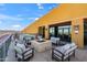Inviting rooftop deck with a fire pit, comfortable seating, and views of the city skyline at 310 S 4Th St # 601, Phoenix, AZ 85004