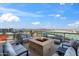 Comfortable rooftop deck area with seating around a fire pit and city views at 310 S 4Th St # 601, Phoenix, AZ 85004