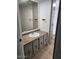 Neutral bathroom featuring a vanity with ample storage and a large mirror at 3104 E Broadway Rd # 207, Mesa, AZ 85204