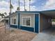 Charming manufactured home with a covered carport and desert landscaping in a well-maintained community at 3104 E Broadway Rd # 207, Mesa, AZ 85204