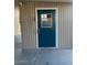 This home has a blue door with a small window and a security camera above the door at 3104 E Broadway Rd # 207, Mesa, AZ 85204