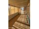 Large enclosed porch with windows and beige carpet, perfect for enjoying the outdoors inside at 3104 E Broadway Rd # 207, Mesa, AZ 85204