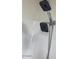 This is a dual shower head with an adjustable hose in an all white bathroom at 3104 E Broadway Rd # 207, Mesa, AZ 85204