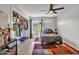 Well-lit bedroom with open closet and laminate flooring at 3500 N Hayden Rd # 203, Scottsdale, AZ 85251