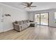 A bright living room featuring a comfortable sectional sofa and sliding glass doors to the outside at 3500 N Hayden Rd # 203, Scottsdale, AZ 85251