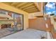 View of the private outdoor patio with sliding glass door access to the home's interior space at 3500 N Hayden Rd # 203, Scottsdale, AZ 85251