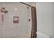 Tiled shower with a built-in niche and modern fixtures at 3500 N Hayden Rd # 203, Scottsdale, AZ 85251