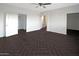 A well-lit bedroom featuring stylish flooring, neutral walls, and a ceiling fan at 35672 W Chipman Rd, Tonopah, AZ 85354