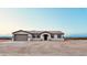 Charming single-story home featuring a neutral color scheme and attached two-car garage at 35672 W Chipman Rd, Tonopah, AZ 85354