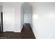 An elegant hallway with an archway entrance and neutral color palette at 35672 W Chipman Rd, Tonopah, AZ 85354