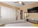 Bedroom with closet, ceiling fan, and wall-mounted TV at 3692 N 292Nd Dr, Buckeye, AZ 85396