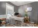 A well lit office space with a desk, shelving, and neutral decor at 3692 N 292Nd Dr, Buckeye, AZ 85396